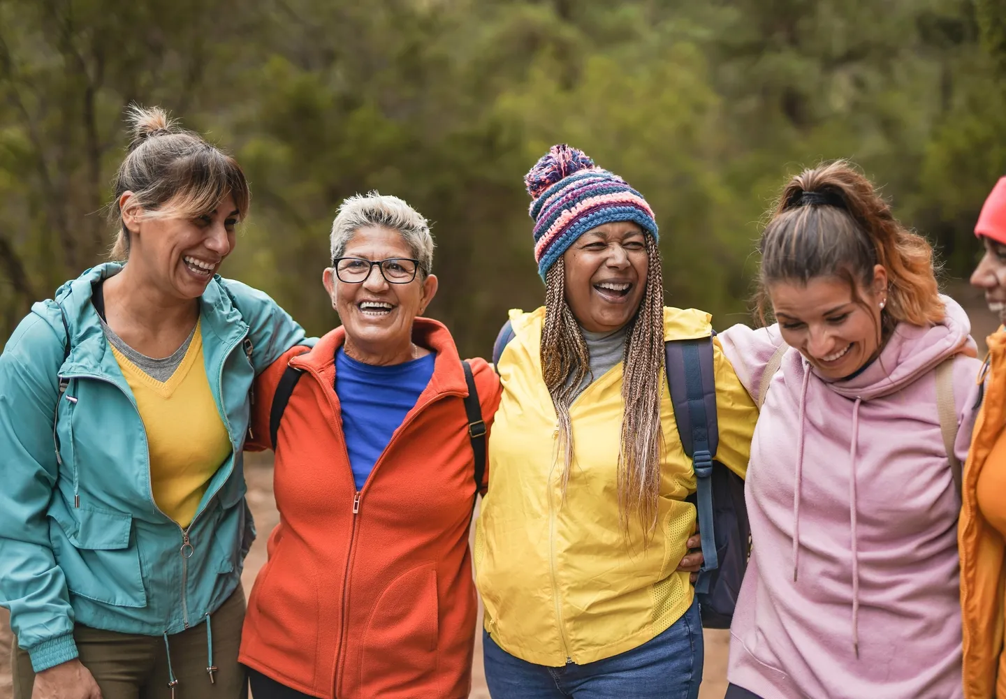 A group of women standing next to each other.